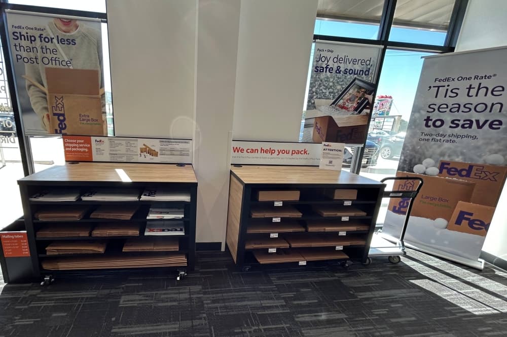 Interior of a FedEx Office featuring a packaging center. 