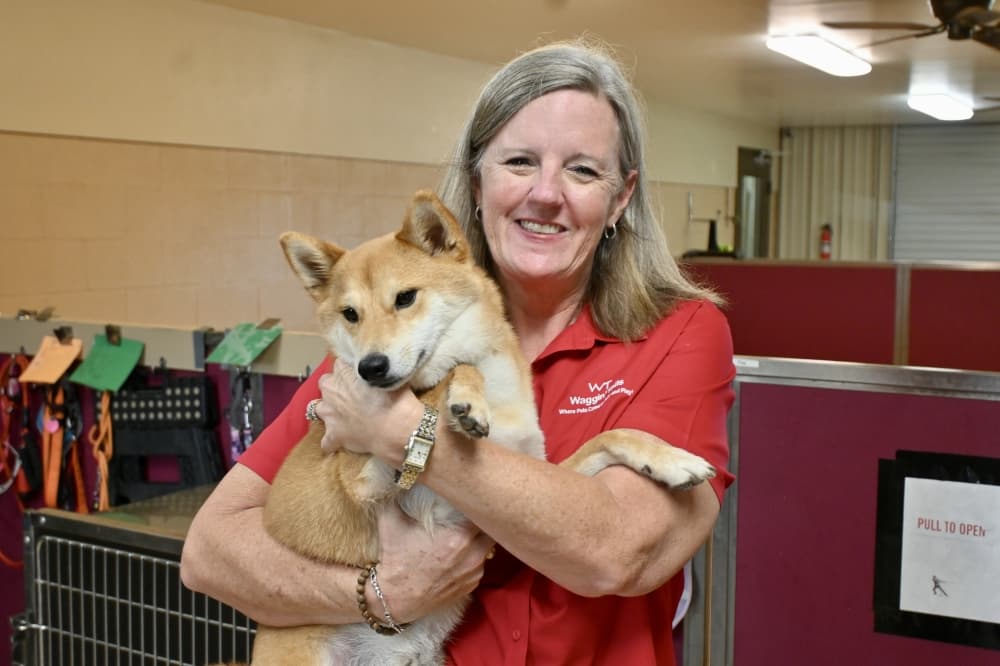 woman holding dog