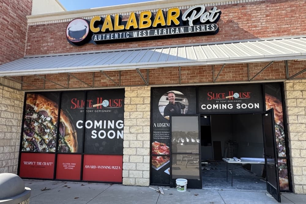 the exterior of a pizza restaurant under construction