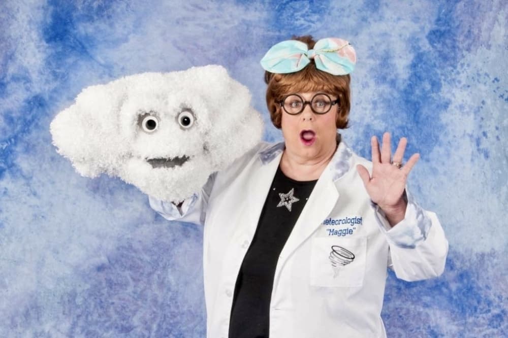 meteorologist with puppet cloud