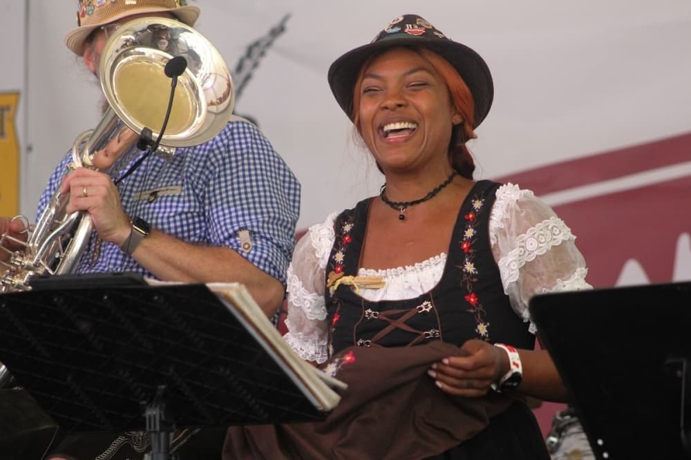 A musician with Austin Polka Band smiles. (Amira Van Leeuwen/Community Impact)