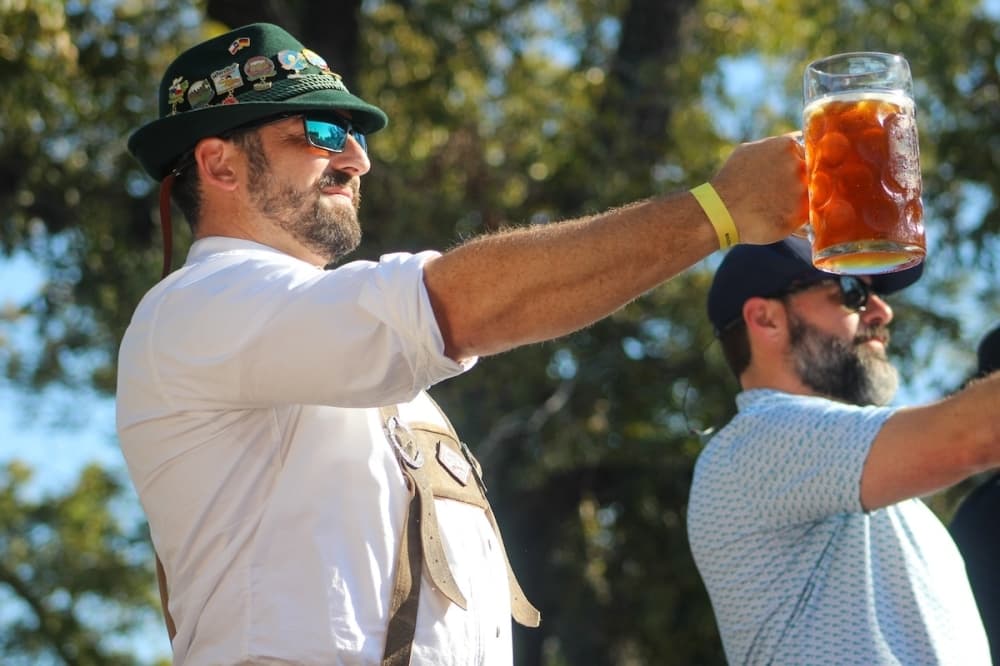 Wurstfest hosted the 2025 Texas Steinholding State Championship Finals at 2 p.m. Nov. 16. Competitors must hold out their arm with a 1-liter stein weighing approximately 3 pounds. (Amira Van Leeuwen/Community Impact)