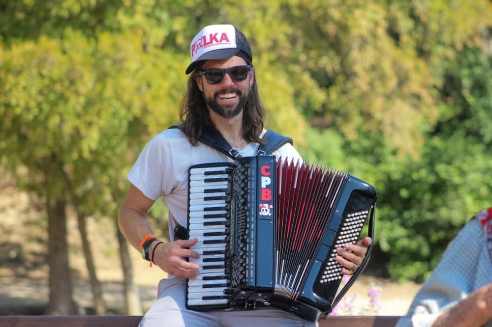 Jake Kouwe plays the accordion at Wurstfest in New Braunfels. (Amira Van Leeuwen/Community Impact)