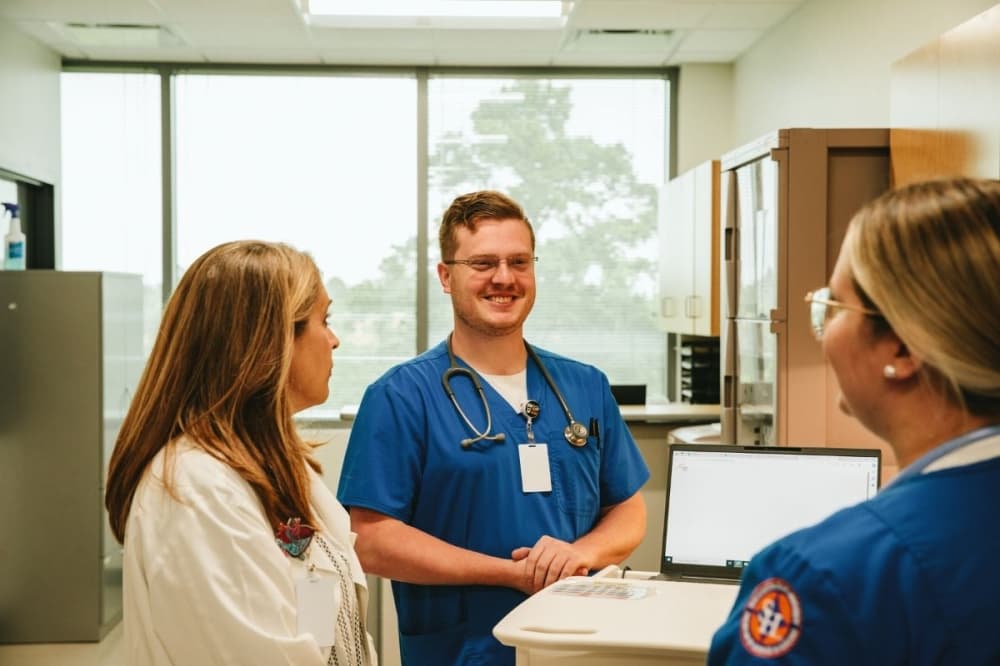 nurses and a doctor talk to each other