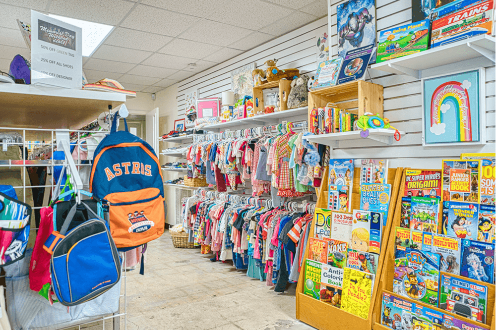 "Colorful racks of new-with-tags clothing and accessories at MAM Resale Store, Houston resale store promoting stability and job readiness for local families"