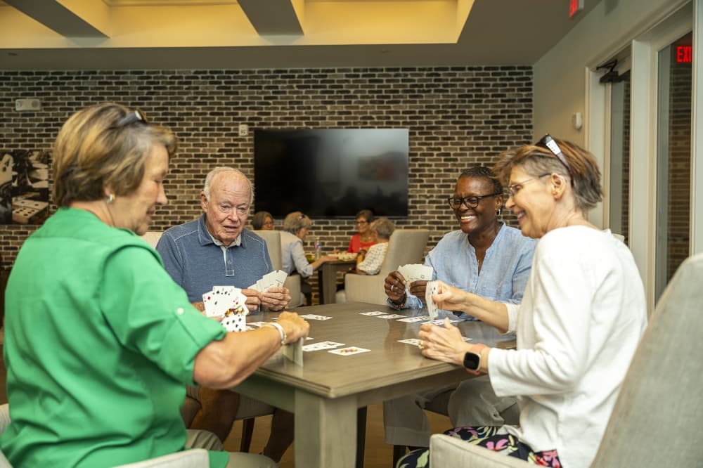 people play cards at a table