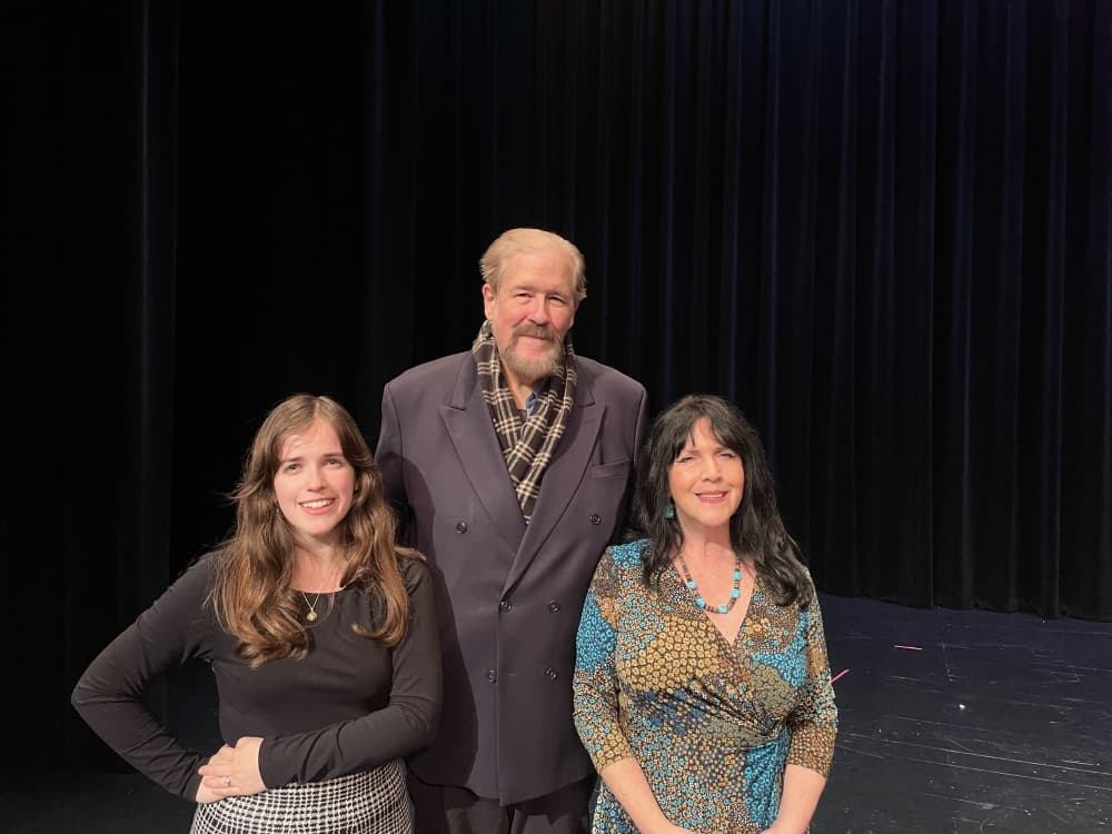 Co-founders Sasha Holloway, right, and Chris Holloway, center, and their daughter, Hannah Auchter posed on stage