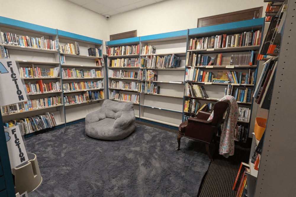 a nook with a bean bag chair in a library