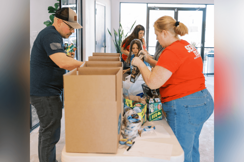 Milestone Church volunteers assembling 1,000 Thanksgiving meal boxes for families in need during holiday outreach event in North Texas