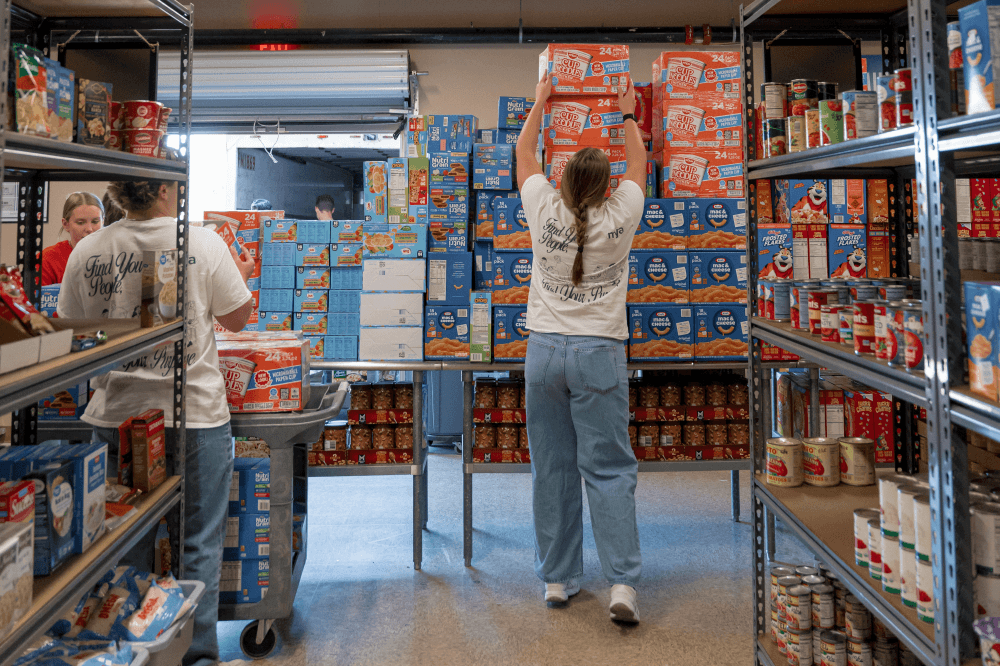Church members shopping for Thanksgiving meal kit items for Milestone Church’s annual holiday outreach program