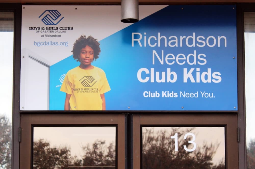 Exterior of a building's doors featuring a Boys & Girls branded sign and 'Richardson Needs Club Kids'.
