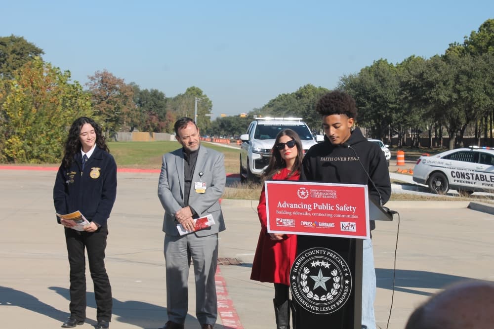 student speaks from behind a podium