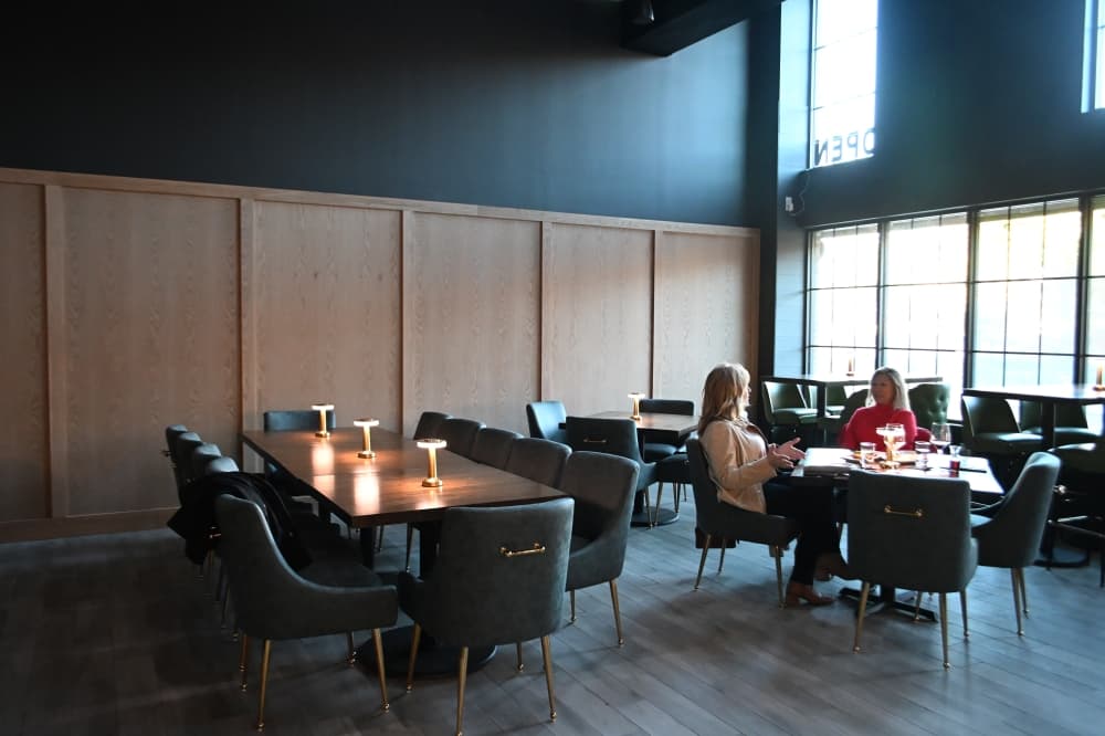 Diners sit in the dining area of Vinifera Wine Lounge & Bistro in Flower Mound's River Walk.
