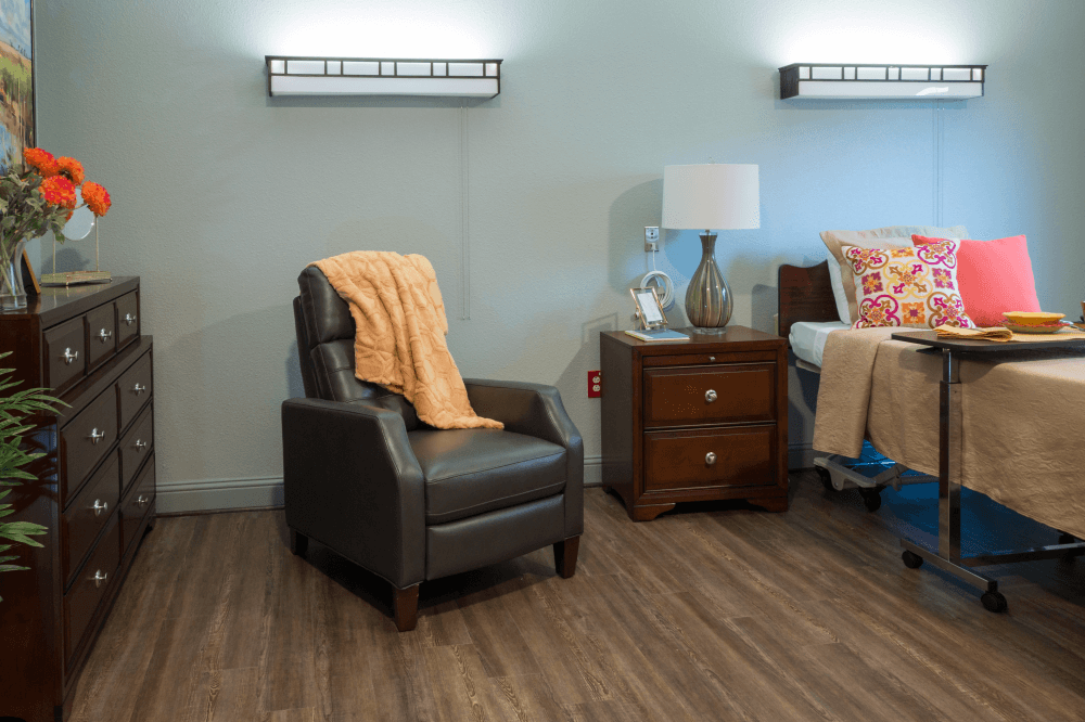 Comfortable private resident room with walk-in shower and modern amenities at The Reserve at Richardson