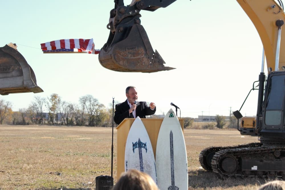 Mayor Bill Cox speaks during groundbreaking ceremony held Dec. 15 near the corner of Stacy Road and SH 121.