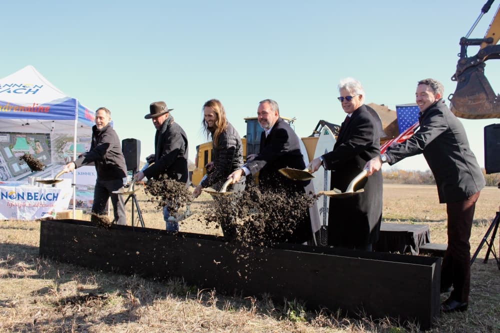 Officials toss dirt with shovels during a groundbreaking ceremony held Dec. 15 near the corner of Stacy Road and SH 121.