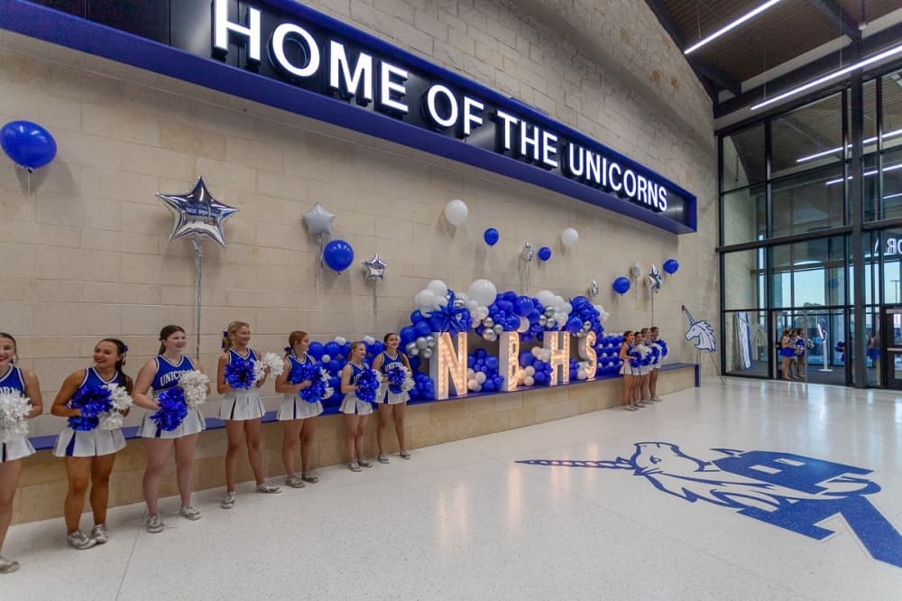 cheerleaders inside of a high school