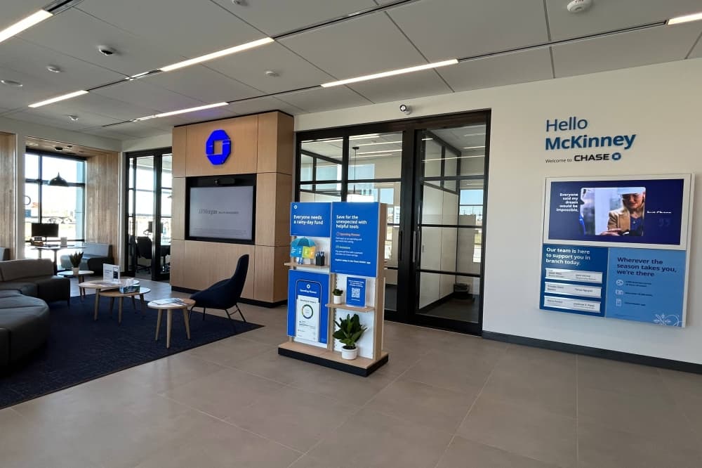 Interior of a building featuring Chase Bank branding and a seating area. 