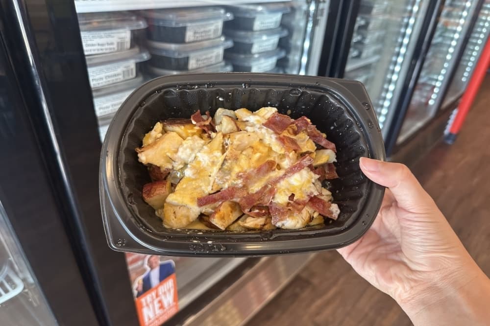 a food container with loaded potatoes