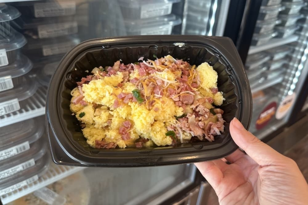 a food container with scrambled eggs