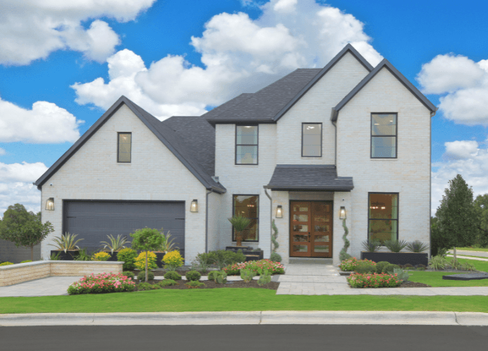 Exterior of a Drees Custom Home in Wolf Ranch Georgetown showcasing modern Hill Country architecture and spacious homesites”