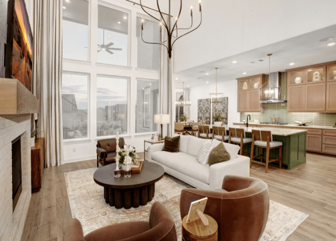 Open-concept interior of a Drees Custom Home at Wolf Ranch with gourmet kitchen, high ceilings and large picture windows