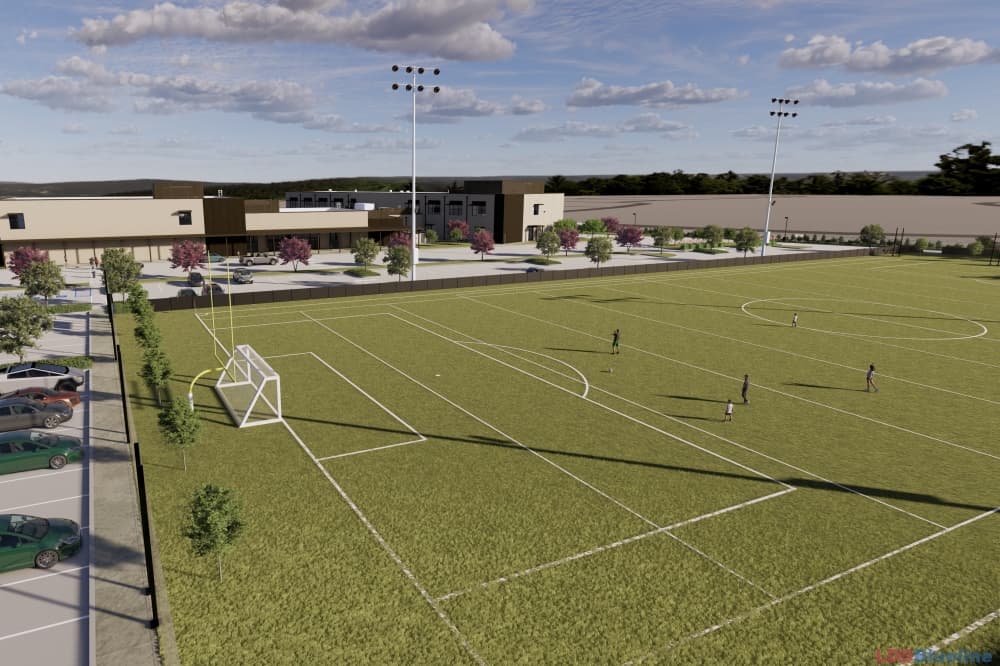 The middle and high school campus will include a soccer field and outdoor basketball court. (Rendering courtesy Harmony Public Schools)