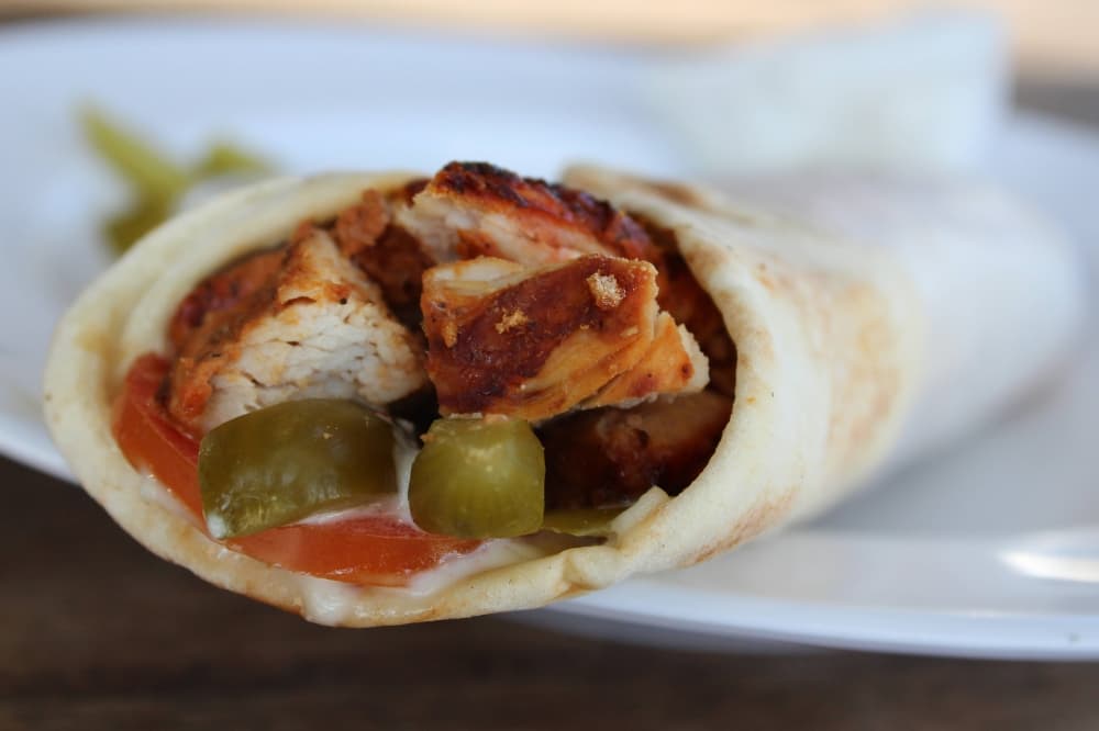 Chicken wrap on a plate. 