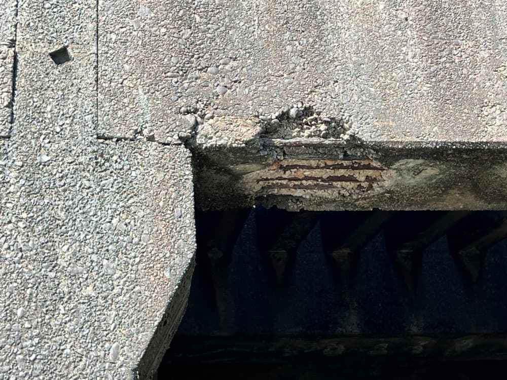 Cracked concrete in one of the Lake Houston Dam support beams shows rebar wire beneath the surface. (Courtesy Coastal Water Authority)