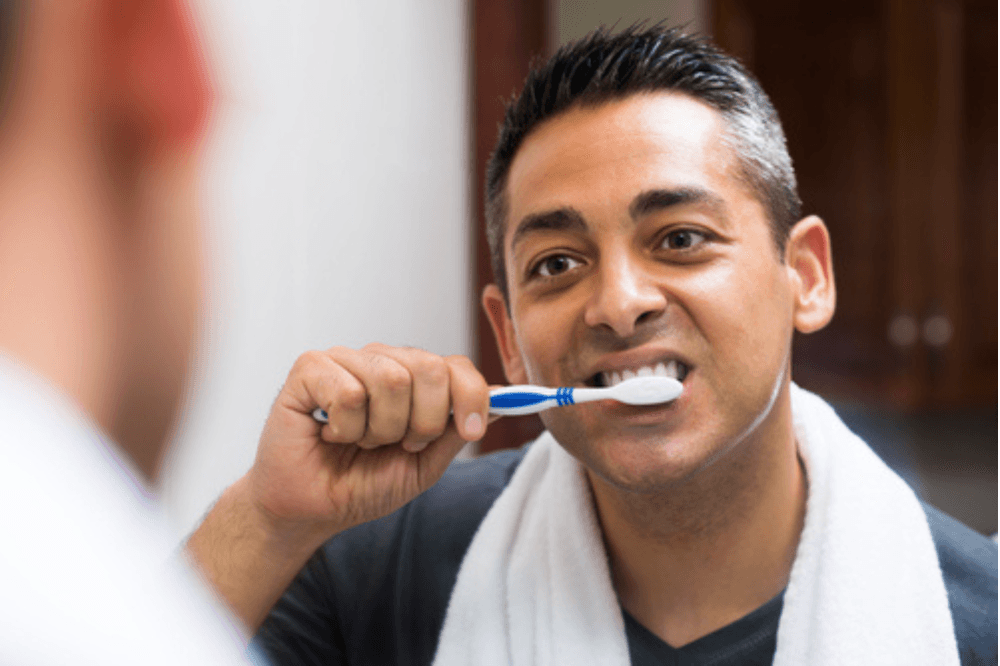 Dental patient brushing teeth