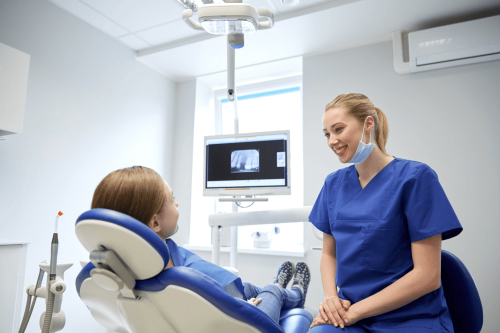 Dentist talking to patient