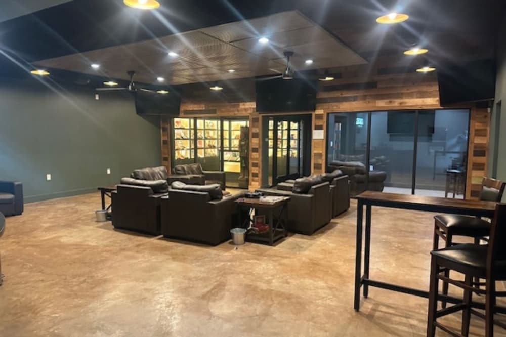 The business features a lounge to smoke cigars and watch sports. (Courtesy Coaches Cigar Lounge)