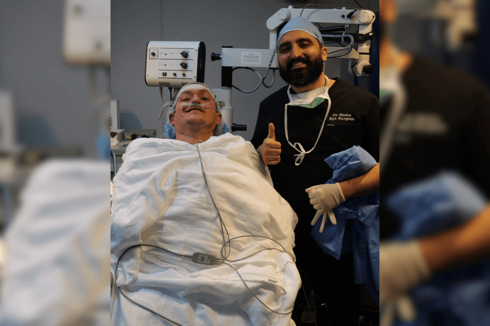 Dr. Shehz smiling with patient going into surgery