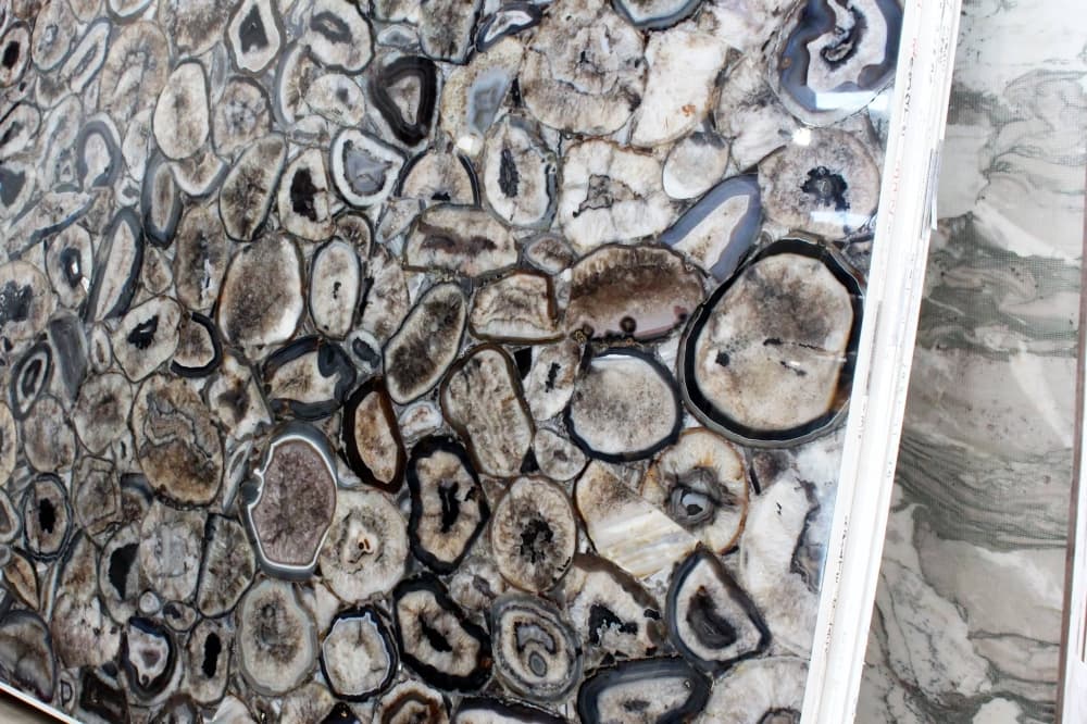 Stone slab featuring non-symmetrical round objects. 