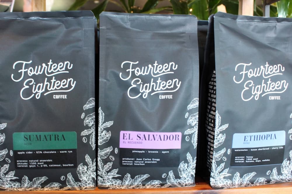 Three bags of coffee featuring Fifteen Eighteen Coffee branding. 