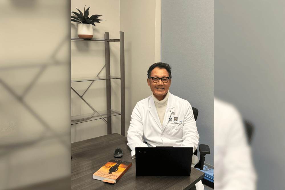 Dr. Pak on his laptop