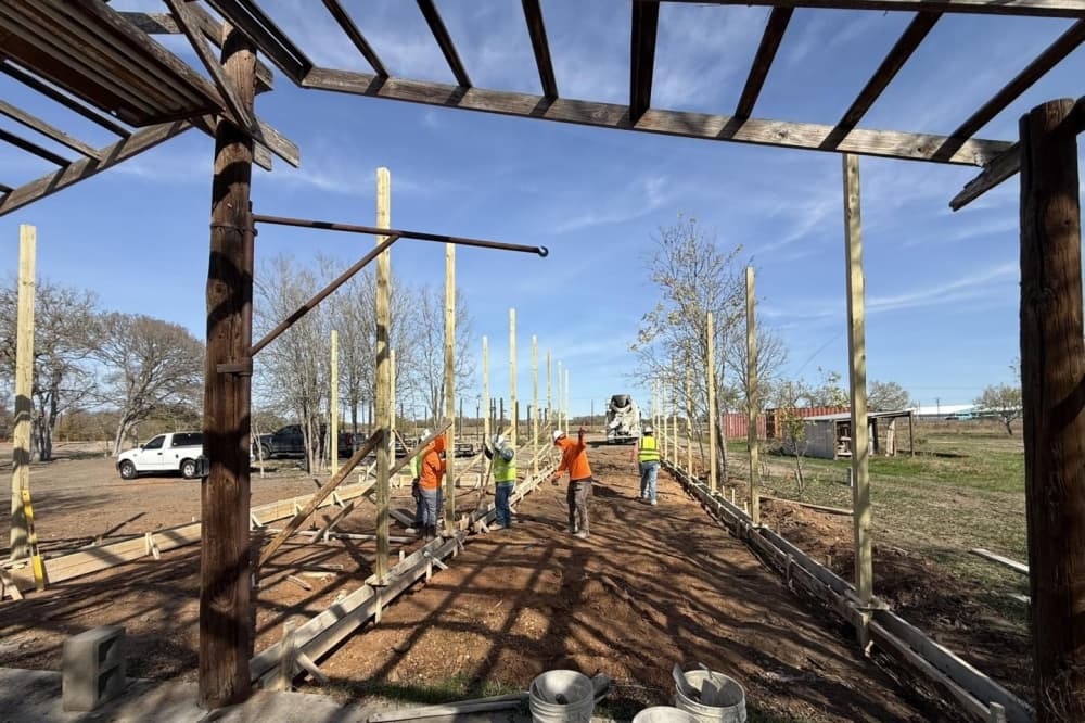 Crews construct a raptor flight cage at Wildlife Rescue of Central Texas' first facility. The cage will allow orphaned and recovering hawks and owls to practice flying before release back to the wild. (Courtesy Wildlife Rescue of Central Texas) 