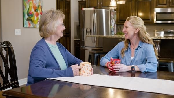 Adult children checking on aging loved one during holiday visit and noticing senior care red flags