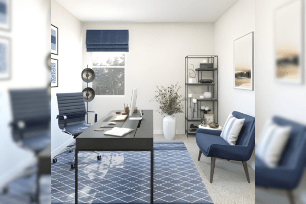 Office space with a blue couch, desk and an office chair