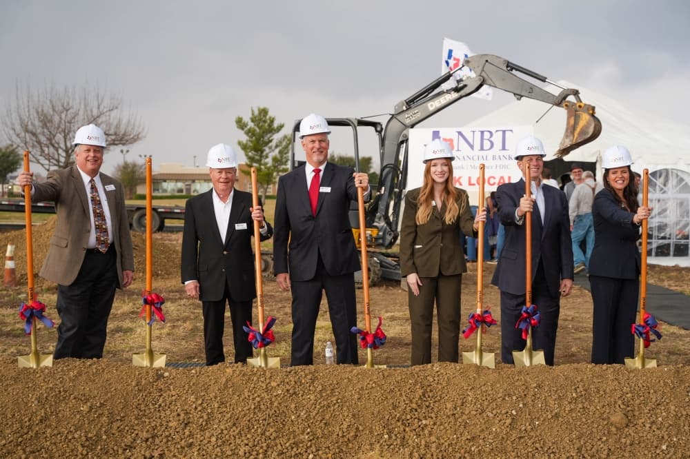 NBT Financial Bank team posing with shovels at groundbreaking event