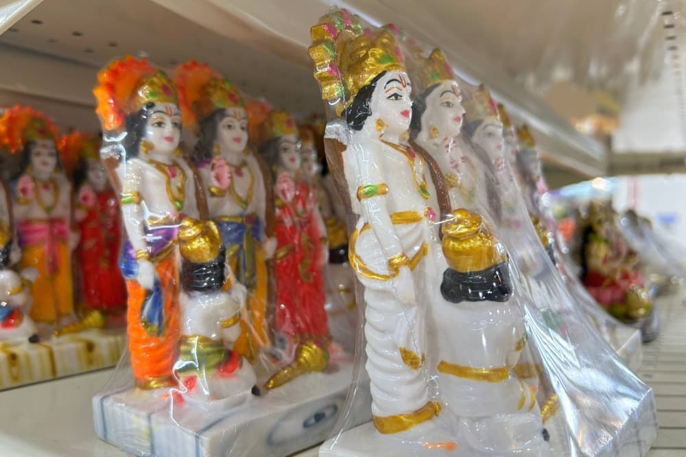 Festival statues on a shelf in a store. 