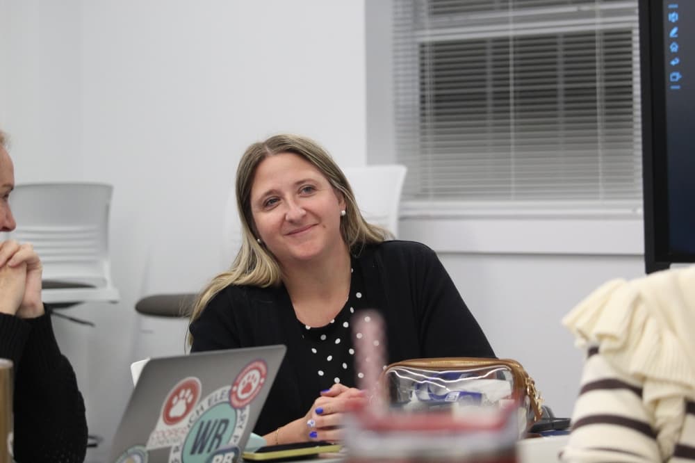 Laura Kincheloe smiles at a board workshop meeting