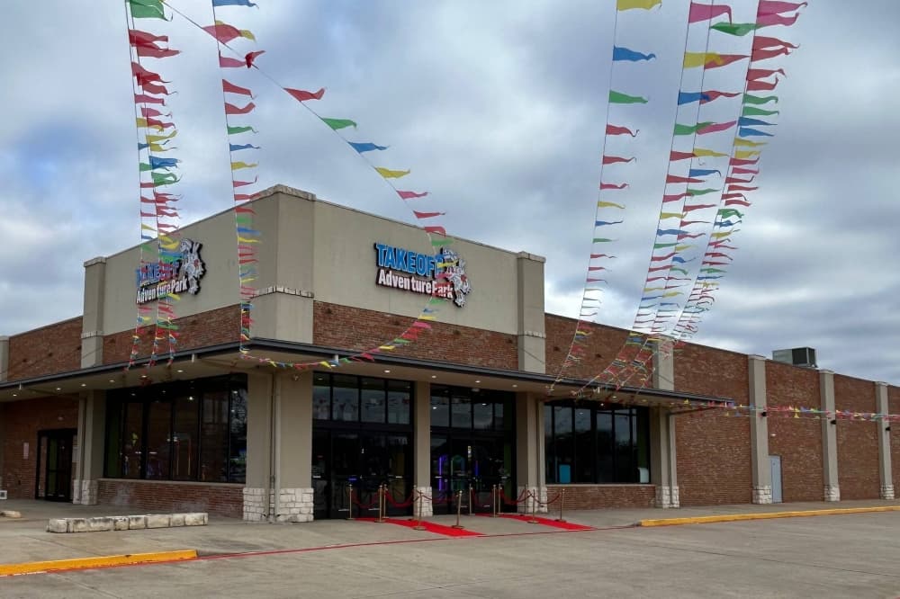 Exterior of a building featuring Takeoff Adventure Park signage. 