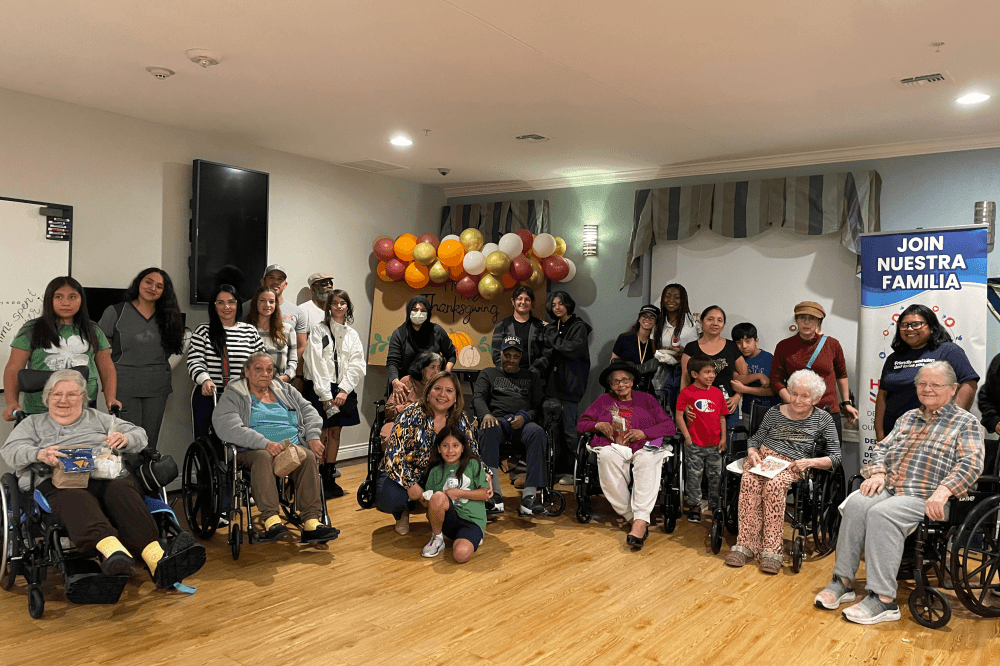 Students pose with nursing home residents