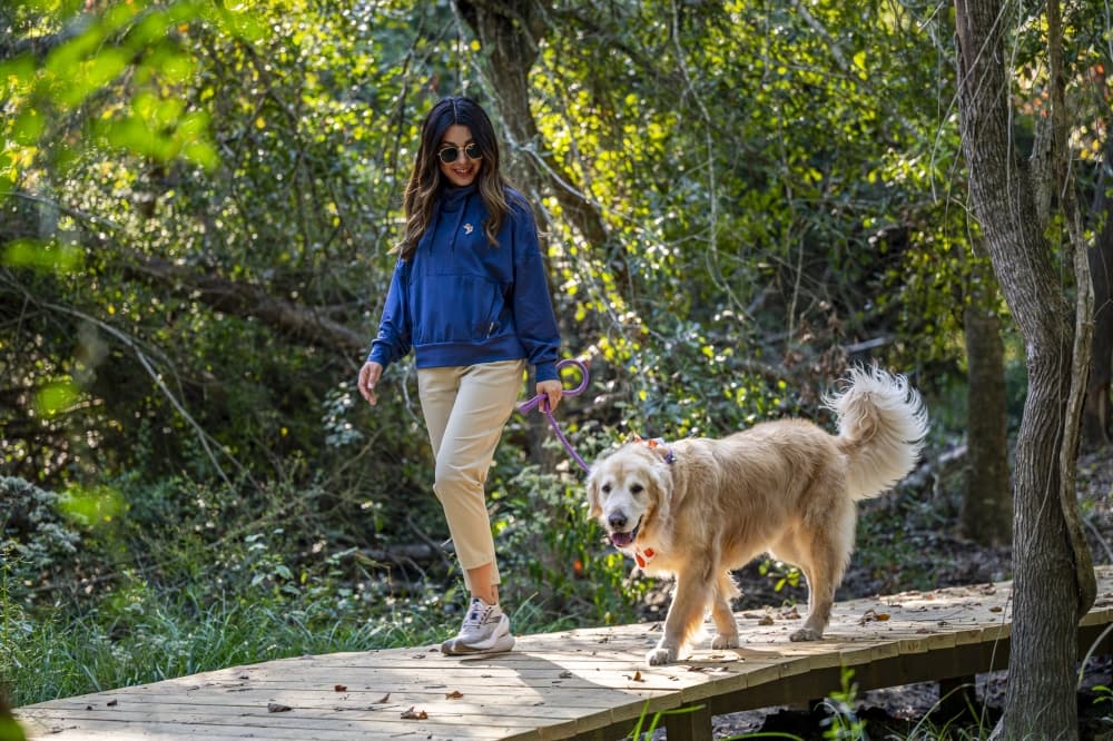 Residents enjoying upscale apartment living at Asher Towne Lake in Towne Lake Cypress, close to nature trails, shopping and dining