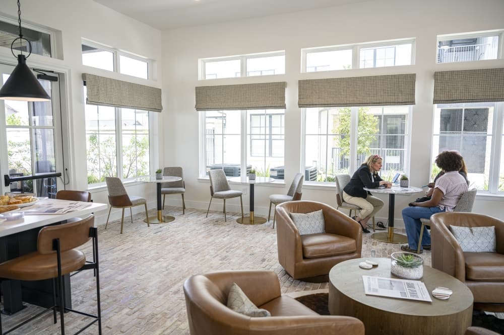Modern luxury apartments with coworking café, fitness center and EV charging at Asher Towne Lake in Cypress, Texas by Caldwell Companies