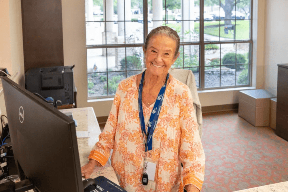 Staff member smiling