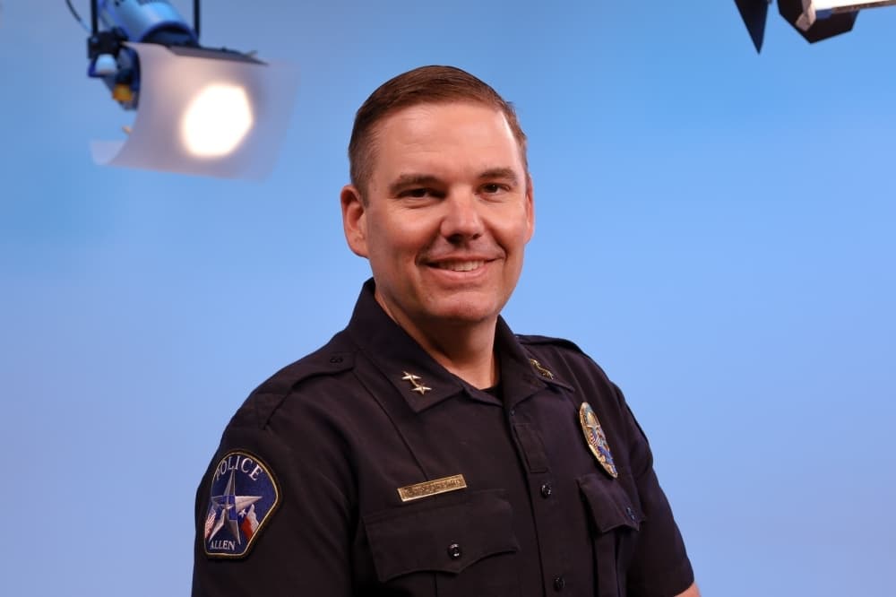 headshot of white man in police uniform
