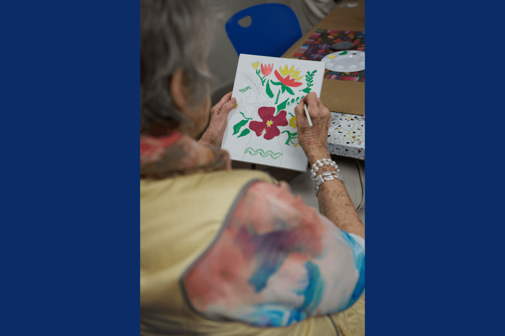 resident painting flowers