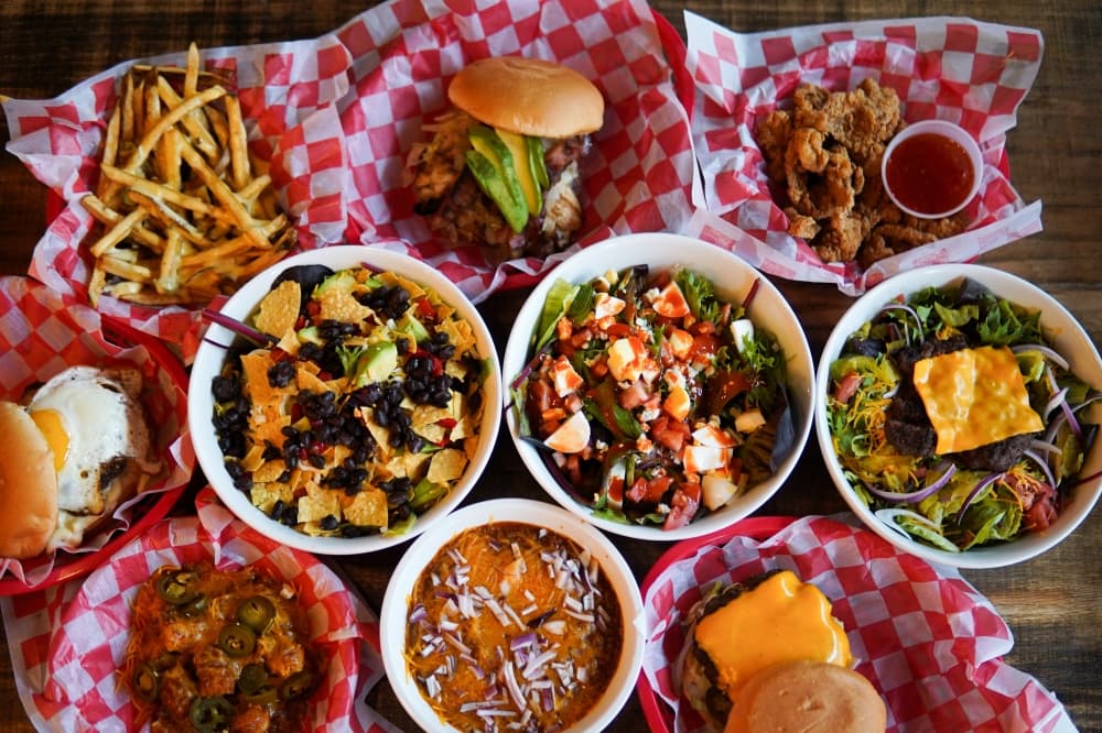 assortment of plates and baskets of food